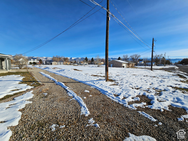 View of yard covered in snow