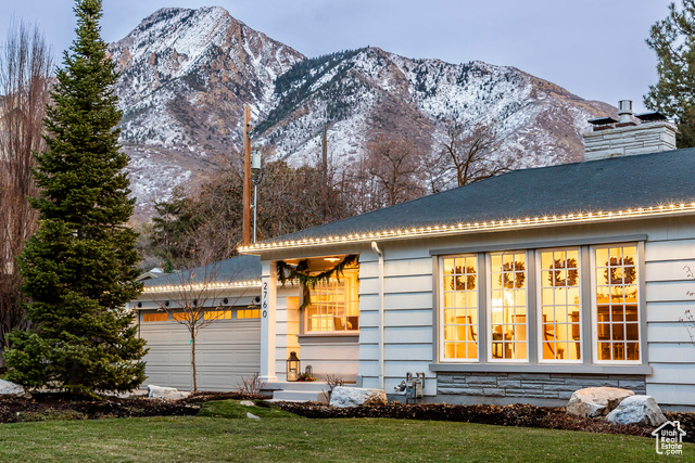 Quietly situated on a dead-end street off Wander Lane, this charming family home on almost a half an acre of land is the definition of privacy and seclusion. Spring Creek Road runs adjacent to the waters of the tree-lined upper canal, giving a sense of coming home to your own rural retreat. A short ten minute walk takes you to the Holladay Village center, where you will find restaurants, boutiques, the Soho Food Park, a library, and the Holladay City Park. Despite the walkability of the area, the nearest freeway entrance is only minutes away - giving you quick access to skiing, hiking, downtown SLC, and the airport. The home itself was completely remodeled 2 years ago, featuring cozy spaces and charming features that emphasize a stylish yet functional design. Large windows and multiple sets of french doors allow abundant natural light, and easy access to the many outdoor seating spaces. The yard has been professionally designed and landscaped, with a patio under a pergola, a hot tub, a magical treehouse (with a retractable film screen for outdoor movies!) a play set, an underground trampoline, and a stone fire pit surrounded by mature trees. The .43 acre property is ideal for outdoor entertaining - both for children and adults. This home's location, large lot, and charming design make it a hidden gem in the heart of Holladay.