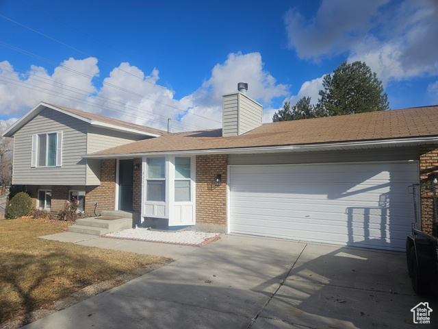 Split level home featuring a garage