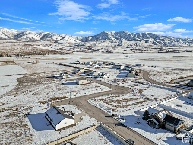 Snowy aerial view featuring a mountain view