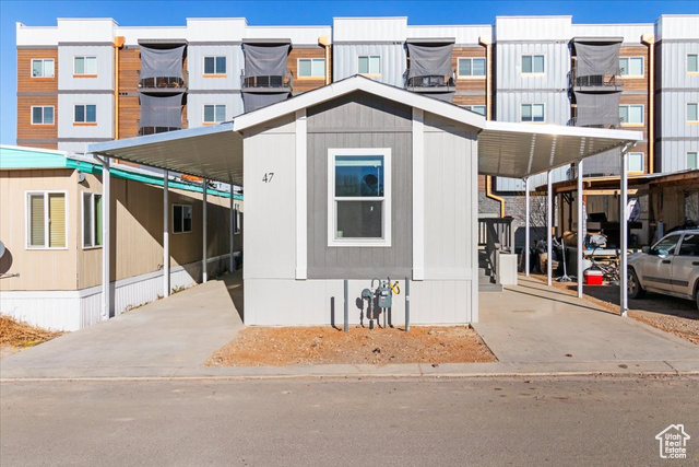 View of front of home with a carport