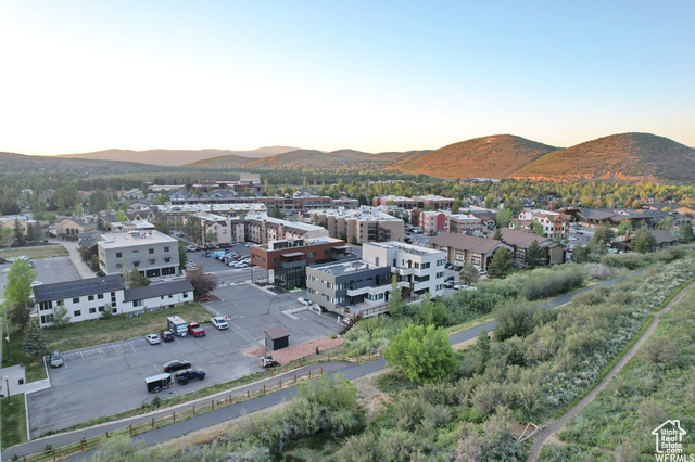 Aerial view at dusk featuring a mountain view