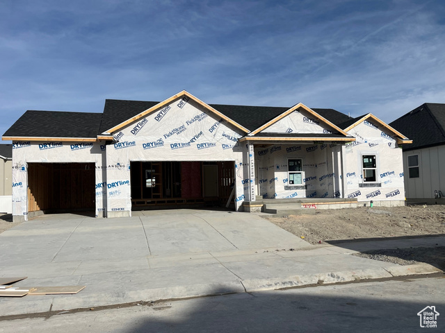 Property under construction with a garage