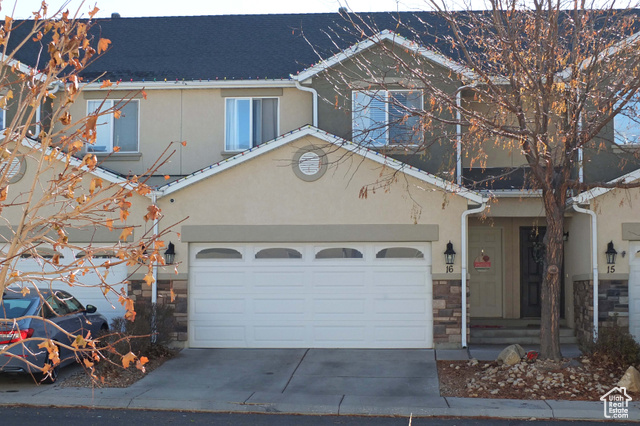 View of front facade featuring a garage