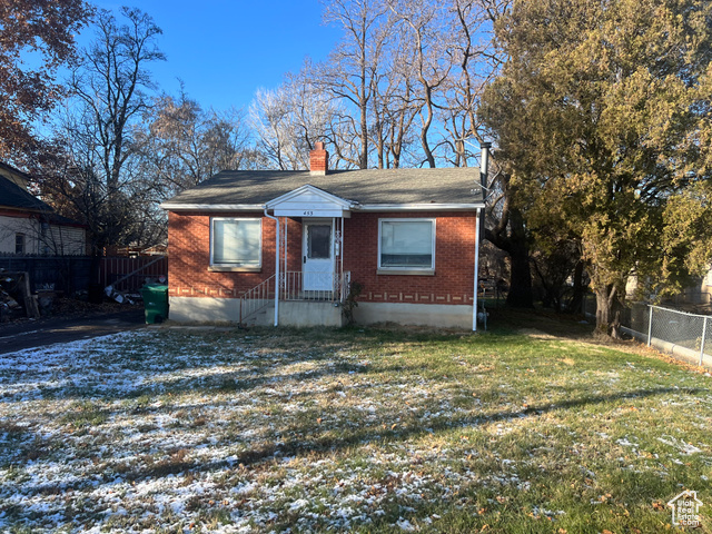 Bungalow with a front lawn