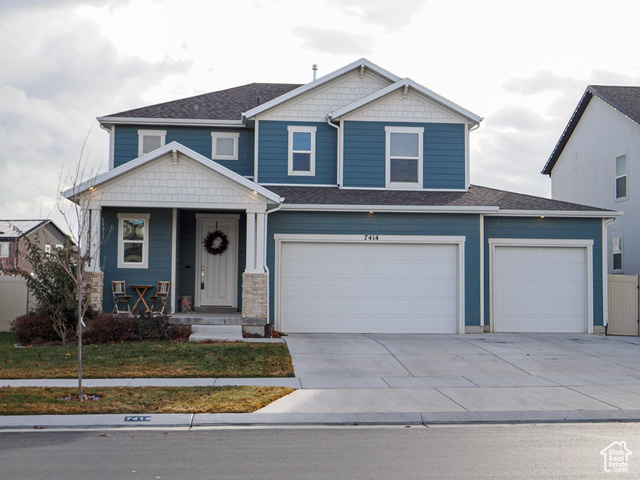 Craftsman-style house featuring a garage