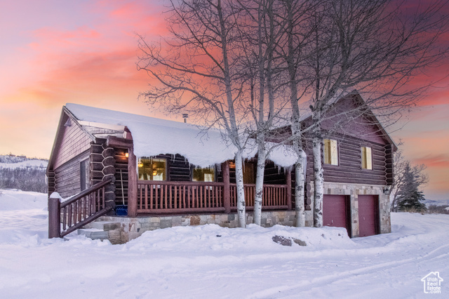 Cabin featuring a garage