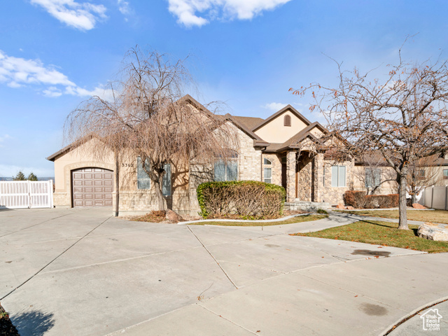 View of front of property featuring a garage