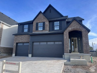 View of front facade featuring a garage