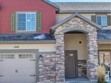 View of front facade with a garage