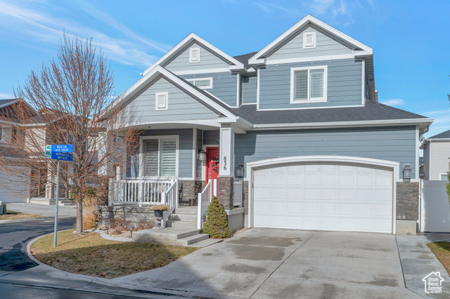 Craftsman-style home with a porch and a garage