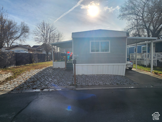 View of front of property featuring a carport