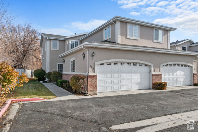 View of property with a garage