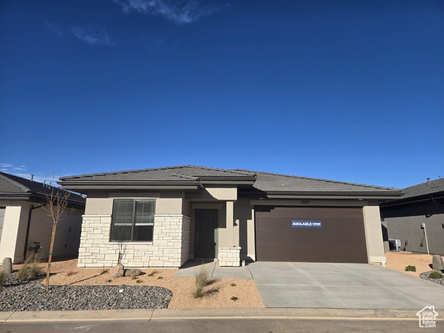 Prairie-style house featuring a garage