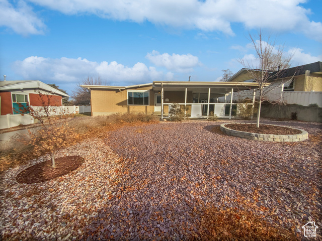 Back of house featuring a sunroom