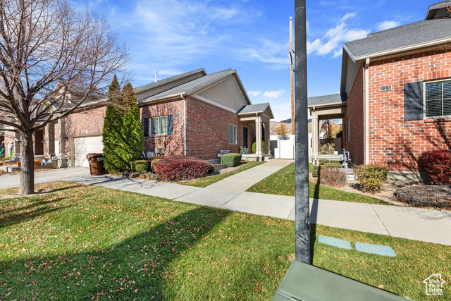 Welcome to your dream 3-bedroom, 2-bath end-row townhouse in Lehi, Utah! This spacious layout features stunning exposed brick accent walls,new updated finishes, large bedrooms, and a cozy basement equipped with a projector screen-perfect for family movie nights. Enjoy outdoor living in the expansive, fenced backyard with a covered porch, ideal for entertaining or relaxing. Located just minutes from a variety of restaurants, this home combines convenience and style for the perfect family retreat!