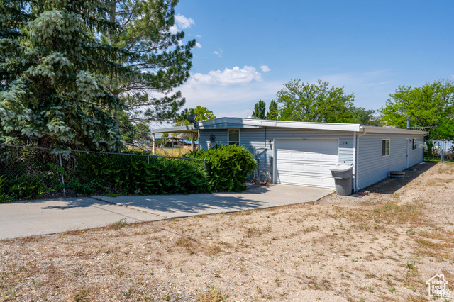 Exterior space with a attached garage