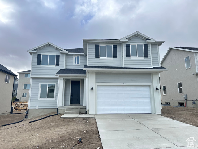 View of front property featuring a garage