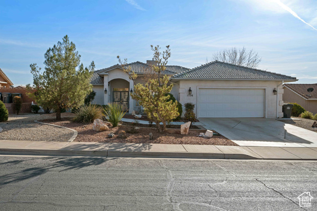 View of front of property featuring a garage