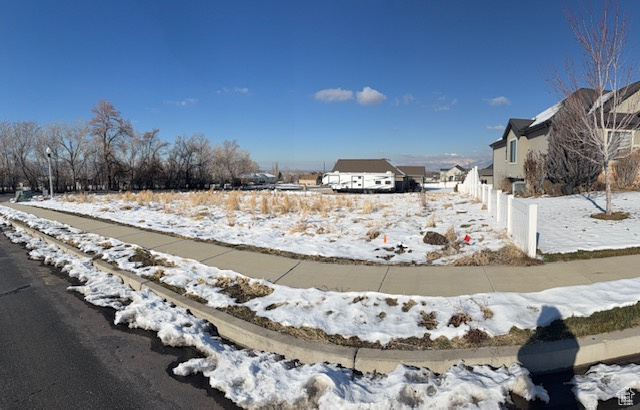 View of yard layered in snow