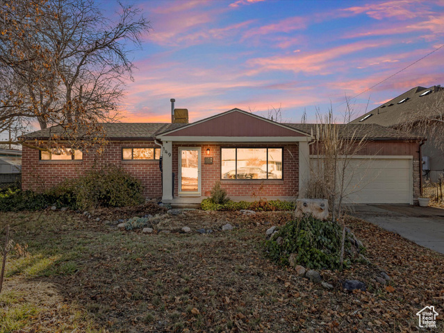 Ranch-style home featuring a garage