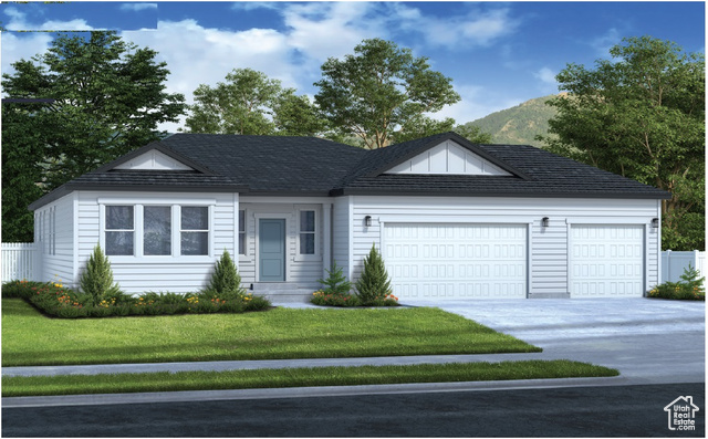 Single story home with a mountain view, a garage, and a front lawn