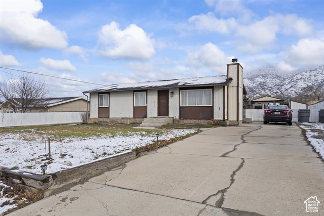 View of front of property with a mountain view