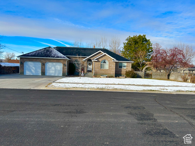 View of front of property featuring a garage