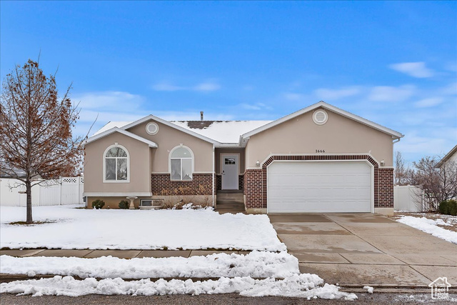 Ranch-style house featuring a garage