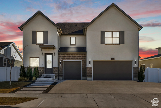 View of front of property featuring a garage