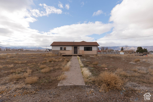 View of front of house featuring a mountain view and a rural view