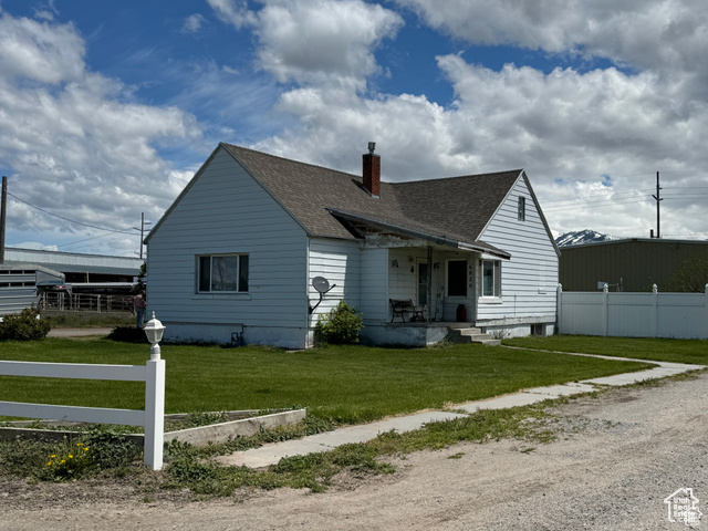 Rear view of house with a lawn