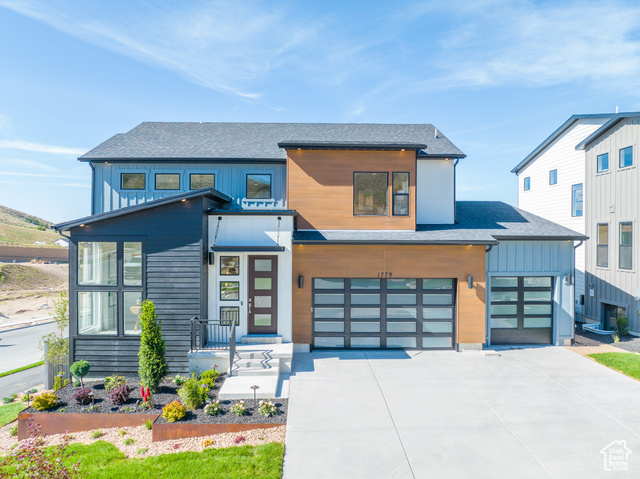 Contemporary home featuring a garage