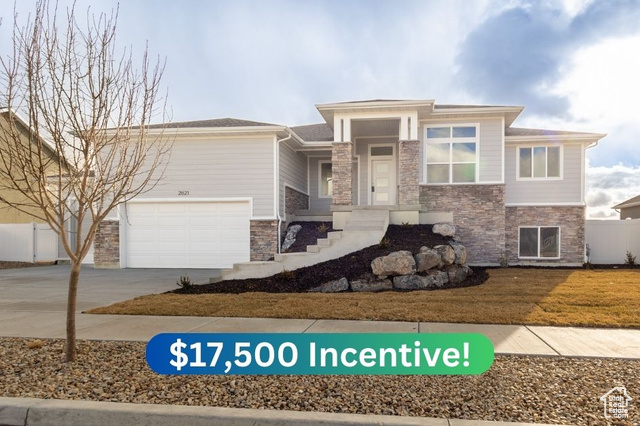 Prairie-style house with a front yard and a garage