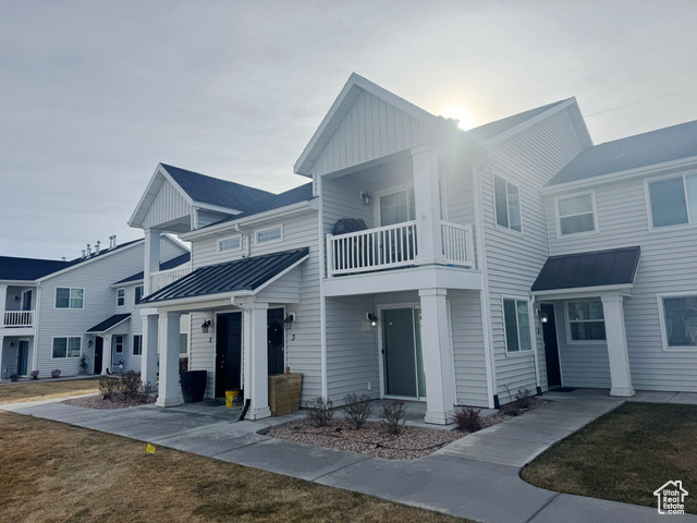 View of front of home with a balcony