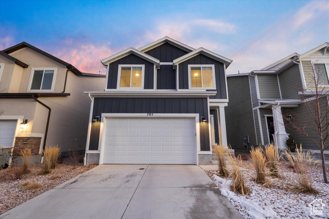 View of front facade featuring a garage