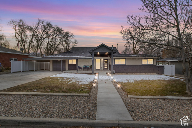 View of front of property with a carport