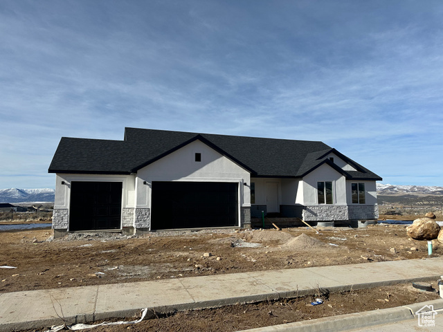 View of front of home featuring a mountain view and a garage-View of front facade with a garageUnder construction-This is a photos from similar model existing product may differ