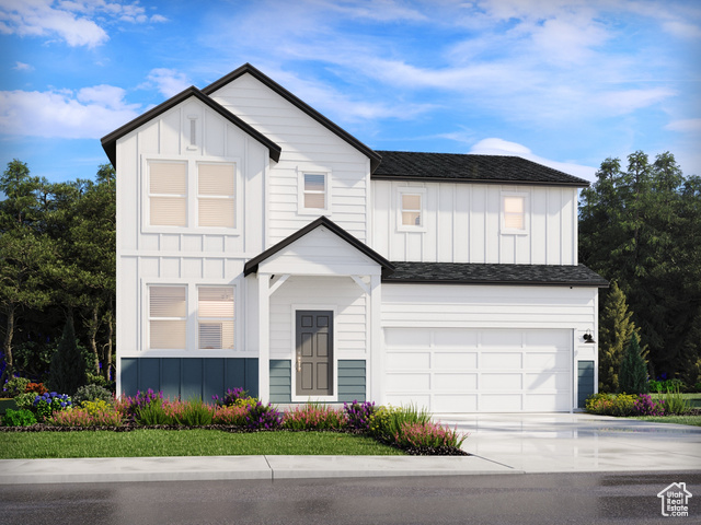 View of front of home featuring a garage