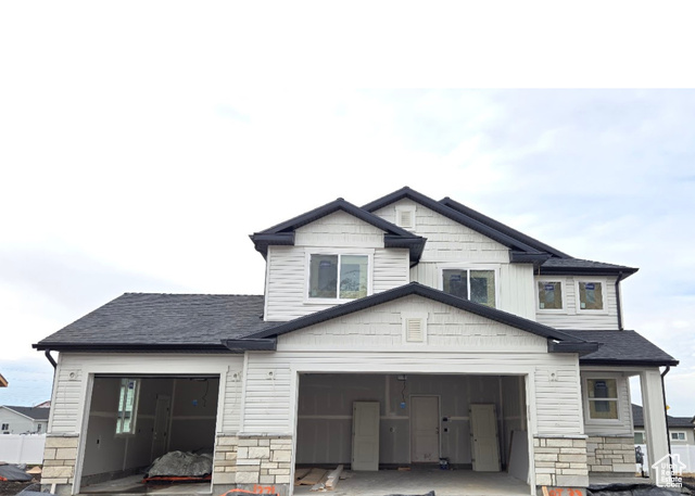 View of front of home featuring a garage