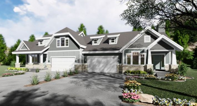 Craftsman inspired home with a garage and a front yard