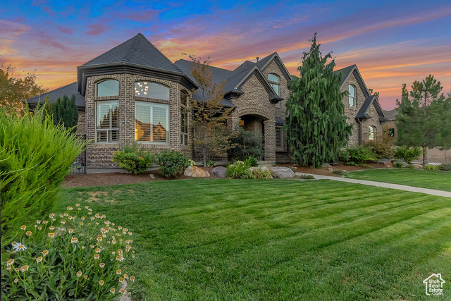 Beautiful two story home in South Jordan. Located in the desirable Nelson Farms Subdivision, this property is next door to South Jordan's Equestrian Park, just 3 minutes away from Bangerter Highway, and 4 minutes away from all the amenities of The District. Fall in love with the grand entry, two-story family room, gourmet kitchen with stunning countertops, backsplash, double ovens, and beautifully stained alder cabinets. Sit down for a casual meal in the kitchen dining nook, or have guests over at the formal dining room. This home is main level living at its best. On the second level you will find 4 bedrooms, a cute hidden play alcove, 2 full bathrooms and a second laundry. The basement can be the place to gather all your family and friends as it boasts two family rooms, a large game room and theater area, kitchenette and bar nook. Walk-out basement only needs a stove to become the perfect mother in law apartment. Additional features include permanent exterior Everlights, eve can lighting, RV pad, plantation shutters throughout, alarm system, central vacuum system, tread lights, intercom, fire sprinkler system, and more. Schedule your showing and make this home yours today.Square footage figures are provided as a courtesy estimate only and were obtained from independent measurements performed. Buyer is advised to obtain an independent measurement.