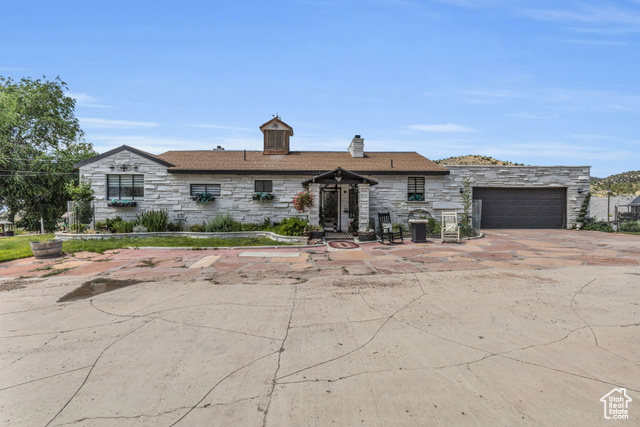 View of front of home featuring a garage