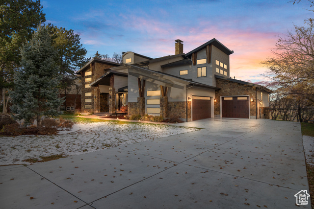 View of property exterior at dusk