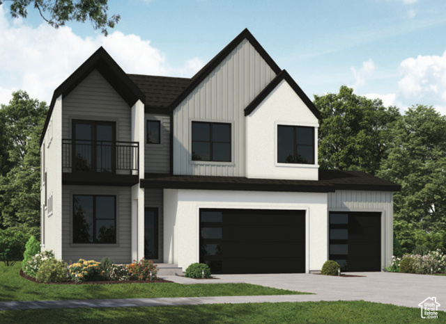 View of front of house featuring a garage, a balcony, and a front yard