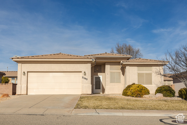 View of front of home featuring a garage