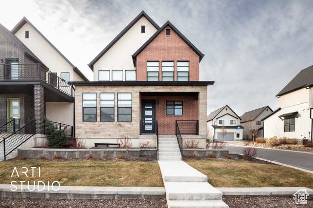 View of front of property featuring a garage