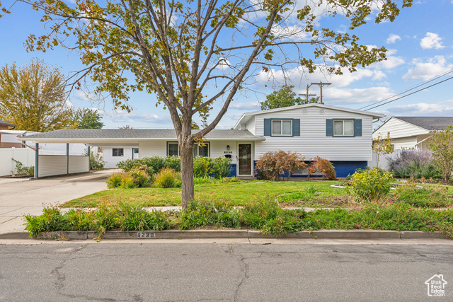 Tri-level home with view of the landscaping, photo taken in Oct