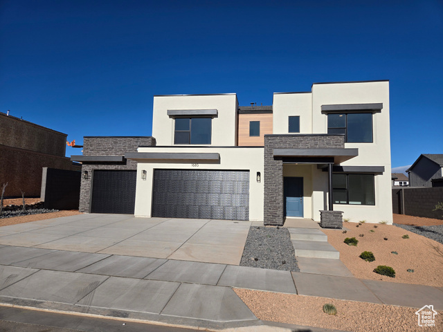 Contemporary house featuring a garage