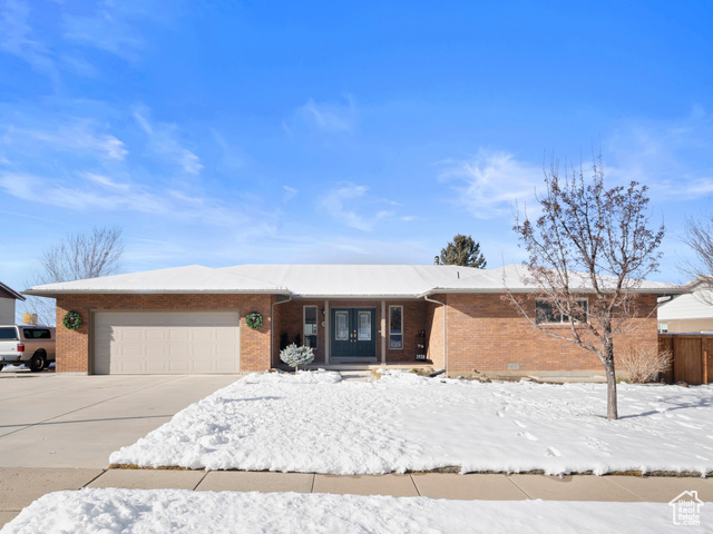 Ranch-style house featuring a garage